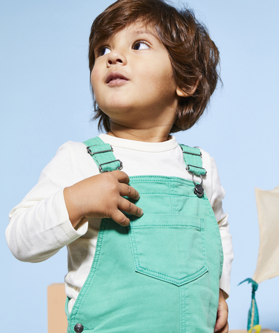 New colour palette Tao Categories - baby boy dungarees in green recycled fibers with message patch